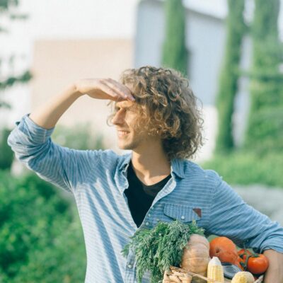 Man Carrying A Basket Of Vegetables